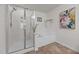 A well-lit bathroom featuring a glass-enclosed shower and a separate soaking tub at 1728 Fern Hollow Trl, Wake Forest, NC 27587