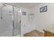 Clean bathroom with tiled floor, glass shower, and soaking tub offers a relaxing and modern spa experience at 1728 Fern Hollow Trl, Wake Forest, NC 27587