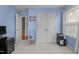 Bright bedroom featuring a double door closet, soft natural light, and stairs leading to another floor at 1728 Fern Hollow Trl, Wake Forest, NC 27587