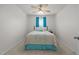 Charming bedroom featuring a floral-patterned bedspread, ceiling fan, and bright, neutral walls at 1728 Fern Hollow Trl, Wake Forest, NC 27587