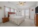 A bright and airy bedroom featuring vaulted ceilings and multiple windows at 1728 Fern Hollow Trl, Wake Forest, NC 27587
