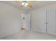 A spacious bedroom with plush carpet, a fan, and closet, providing ample storage and comfort at 1728 Fern Hollow Trl, Wake Forest, NC 27587