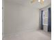 Comfortable bedroom with plush carpeting, a ceiling fan, and soft natural light, perfect for relaxation at 1728 Fern Hollow Trl, Wake Forest, NC 27587