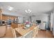 An open floor plan combining the kitchen, dining area, and living room at 1728 Fern Hollow Trl, Wake Forest, NC 27587