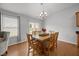 A bright dining area features sliding glass doors leading to the backyard at 1728 Fern Hollow Trl, Wake Forest, NC 27587