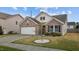 A cozy one-story home boasting a manicured lawn and a convenient attached garage at 1728 Fern Hollow Trl, Wake Forest, NC 27587