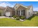 Charming single-Gathering home featuring a brick facade, manicured lawn, and a well-maintained landscape at 1728 Fern Hollow Trl, Wake Forest, NC 27587