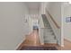 Inviting home entryway with hardwood floors and a staircase, leading to a bright and open living space at 1728 Fern Hollow Trl, Wake Forest, NC 27587