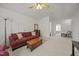 Comfortable living room featuring a cozy seating arrangement and neutral tones, perfect for relaxation at 1728 Fern Hollow Trl, Wake Forest, NC 27587