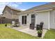 Backyard patio with outdoor seating, creating a welcoming space for gatherings and enjoying the outdoors at 1728 Fern Hollow Trl, Wake Forest, NC 27587