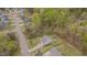 An aerial view shows the house, lot and neighborhood with established trees around the perimeter at 190 Alcock Ln, Youngsville, NC 27596