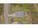 An aerial view of the house, showcasing the landscaped backyard with a gazebo and patio at 190 Alcock Ln, Youngsville, NC 27596