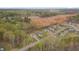 A high angle aerial shows the neighborhood and surrounding land in a desirable location at 190 Alcock Ln, Youngsville, NC 27596