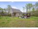 Spacious backyard with a patio featuring a gazebo, fire pit, and comfortable seating area at 190 Alcock Ln, Youngsville, NC 27596