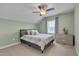 This bedroom is bright and open with a neutral palette and a ceiling fan for circulation at 190 Alcock Ln, Youngsville, NC 27596
