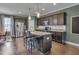 Spacious kitchen featuring a central island, stainless steel appliances, and dark cabinetry at 190 Alcock Ln, Youngsville, NC 27596