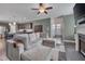 Open-concept living room with hardwood floors seamlessly connects to the kitchen and dining area at 190 Alcock Ln, Youngsville, NC 27596