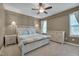 Comfortable main bedroom with a ceiling fan, natural light, and neutral color scheme at 190 Alcock Ln, Youngsville, NC 27596