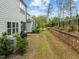 Spacious backyard with lush landscaping, a privacy fence, and ample space for outdoor activities at 1915 Kings Knot Ct, Apex, NC 27502
