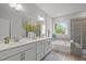 Elegant bathroom with double vanity, soaking tub, and walk-in shower at 1915 Kings Knot Ct, Apex, NC 27502