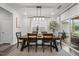 Dining room with large window and modern chandelier at 1915 Kings Knot Ct, Apex, NC 27502