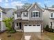 Charming two-story home featuring a stone facade and a two-car garage at 1915 Kings Knot Ct, Apex, NC 27502