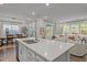 View of the kitchen island with an open concept to the dining and living rooms at 1915 Kings Knot Ct, Apex, NC 27502