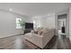 Modern living room with plush seating, large windows, and a contemporary aesthetic at 1915 Kings Knot Ct, Apex, NC 27502