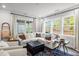 Inviting living area with stylish seating, plush cushions, and a view of the outdoors at 1915 Kings Knot Ct, Apex, NC 27502