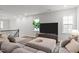 Bright living room with ample natural light, modern furnishings, and stylish decor at 1915 Kings Knot Ct, Apex, NC 27502