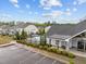 Community pool surrounded by well-maintained landscaping and ample parking space in a residential neighborhood at 1915 Kings Knot Ct, Apex, NC 27502
