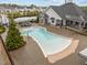 Aerial view of the community pool with lounge chairs and landscaped surroundings at 1915 Kings Knot Ct, Apex, NC 27502