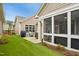 Spacious backyard featuring a patio area with an outdoor grill and a screened-in porch at 2112 Bradford Mill Ct, Apex, NC 27539