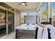 Luxurious hot tub installed in a screened-in porch for year-round enjoyment and relaxation at 2112 Bradford Mill Ct, Apex, NC 27539