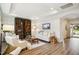 Bright living room with wood floors, recessed lighting, built-in bookcase and neutral furniture at 2112 Bradford Mill Ct, Apex, NC 27539