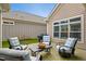 Inviting outdoor patio with comfortable seating and a grill, ideal for summer gatherings at 2112 Bradford Mill Ct, Apex, NC 27539