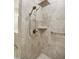 Elegant walk-in shower with dual showerheads, grab bar, and a corner shelf for added convenience at 2112 Bradford Mill Ct, Apex, NC 27539