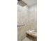 Comfortable walk-in shower with grab bar, built-in bench, and tiled walls from floor to ceiling at 2112 Bradford Mill Ct, Apex, NC 27539