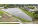 Scenic aerial view of the community lake with a walking trail and gazebo at 2157 Blue Iris Way, Zebulon, NC 27597