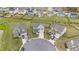 Aerial view of a home in a cul-de-sac, surrounded by well-maintained lawns and neighborhood houses at 2157 Blue Iris Way, Zebulon, NC 27597