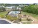 Aerial view of the community amenities, including a pool, a clubhouse, and playground area at 2157 Blue Iris Way, Zebulon, NC 27597