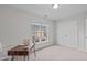 This bedroom is bright and airy, featuring a large closet, neutral walls and carpet at 228 Dove Cottage Ln, Cary, NC 27519