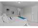 Bright bedroom features neutral walls, carpet flooring, and decoratively appointed with artwork and a blue throw at 228 Dove Cottage Ln, Cary, NC 27519
