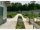 A well-maintained community garden with raised garden beds, offering residents fresh produce at 228 Dove Cottage Ln, Cary, NC 27519