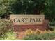 Stone sign for Cary Park community surrounded by lush greenery and landscaping at 228 Dove Cottage Ln, Cary, NC 27519