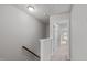 Well-lit hallway leads to bedrooms and bathrooms, complemented by neutral tones and carpeted floors at 228 Dove Cottage Ln, Cary, NC 27519