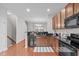 Well-maintained kitchen features stainless steel appliances, granite countertops, and modern cabinetry at 228 Dove Cottage Ln, Cary, NC 27519