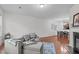 Cozy living room featuring a comfortable sofa and a view into the dining room at 228 Dove Cottage Ln, Cary, NC 27519