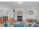 Inviting living room featuring a fireplace, stylish decor, and hardwood flooring at 228 Dove Cottage Ln, Cary, NC 27519
