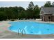 Refreshing community pool with ample seating and a bath house is the perfect place to relax at 228 Dove Cottage Ln, Cary, NC 27519